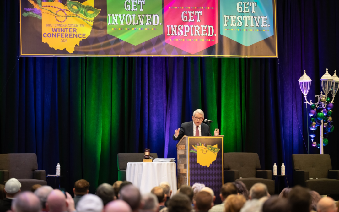 Ohio Governor Mike DeWine speaks as the keynote at OCDC conference Mardi Gras theme